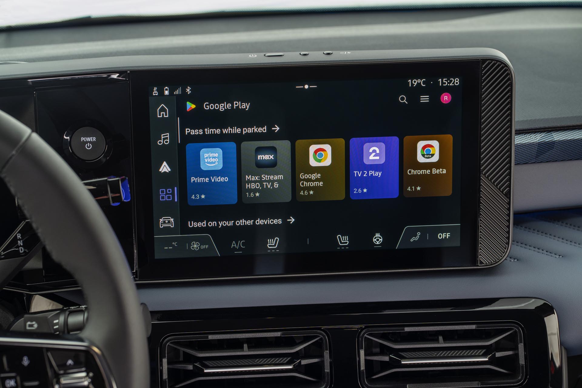 Detailed view of infotainment screen showing apps on Google Play store