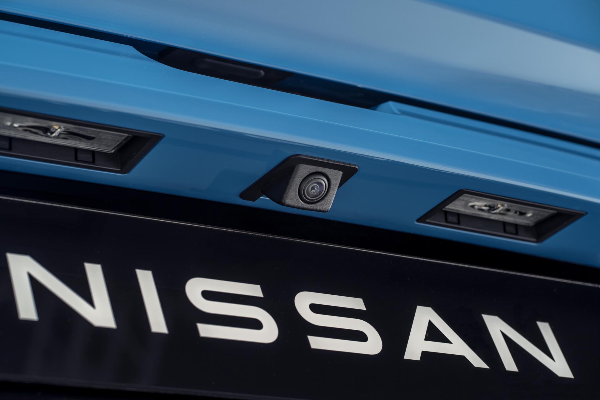 detailed Nissan name plate under the rear around view camera
