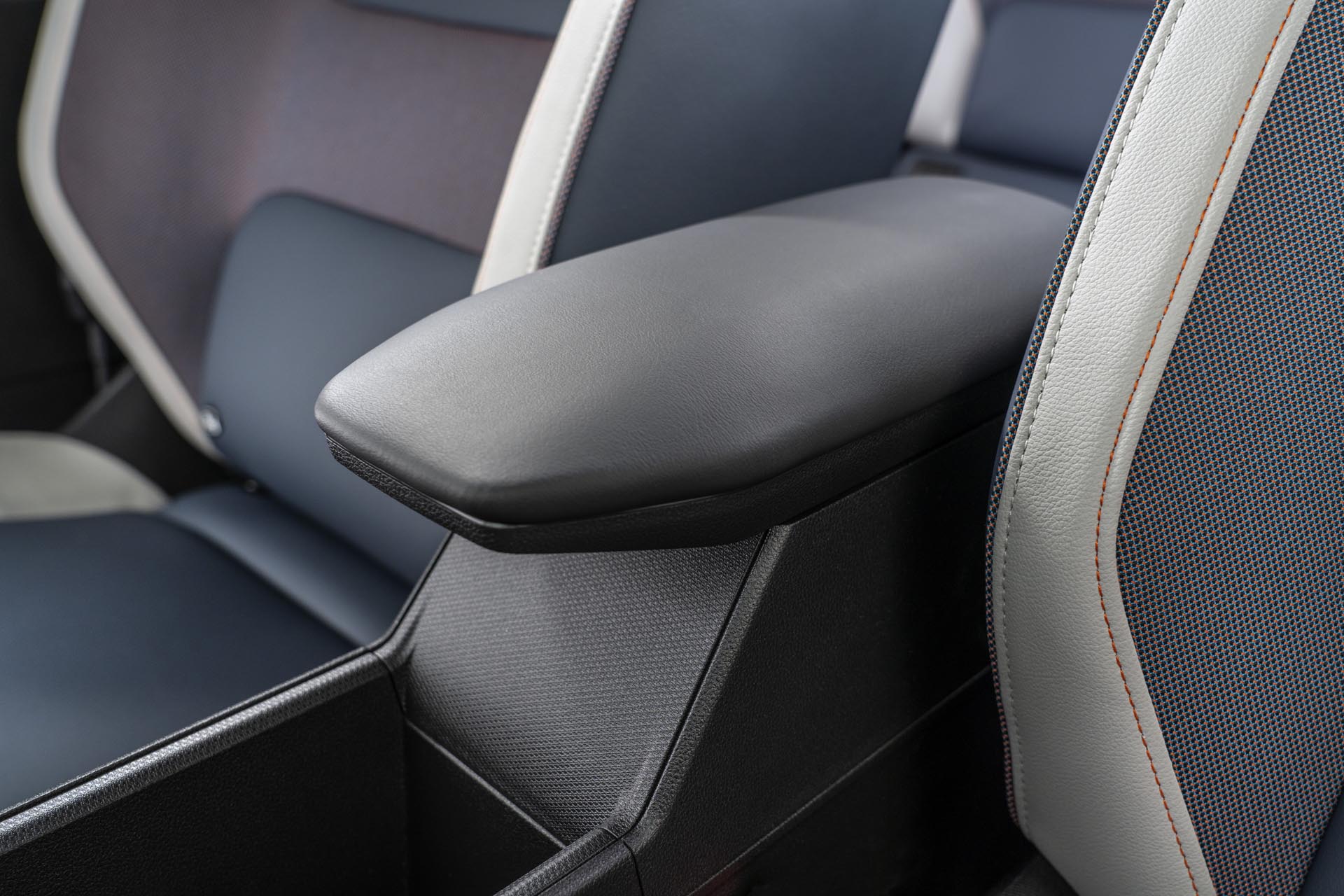 detailed view of front seat materials and center storage console